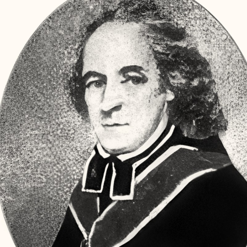 Ksiądz Daniel Kazimierz Narbutt w ciemnej sutannie z orderami, portret malarski w owalnej ramie